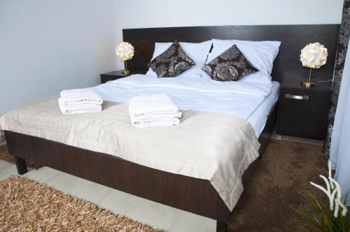 Posteľ alebo postele v izbe v ubytovaní Apartament IKAR blisko morza