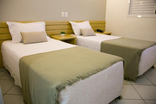 Postel nebo postele na pokoji v ubytování Hotel Sansaed
