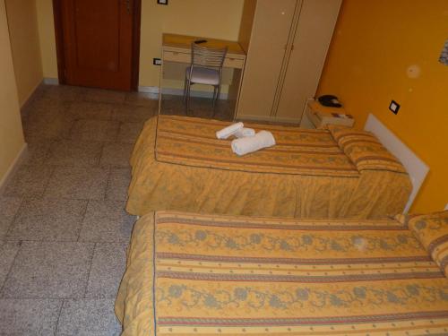 Кровать или кровати в номере Hotel Mariagrazia