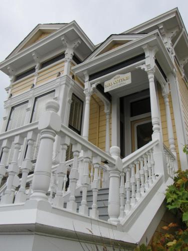 a white colonial house with a white balcony at Carter House Inns in Eureka