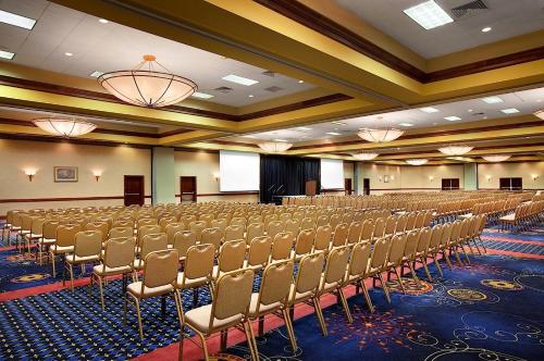 a large room with rows of chairs in it at Capitol Plaza Hotel Jefferson City in Jefferson City