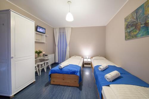 Katil atau katil-katil dalam bilik di Hotel Nowa Panorama