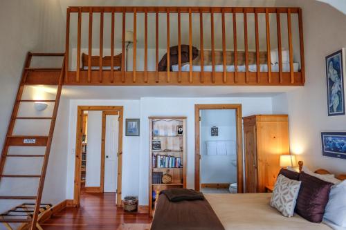 a bedroom with a bunk bed and a staircase at Lost Whale Inn in Trinidad