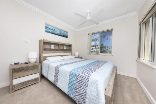 a bedroom with a bed and two windows at Whitesands 602 - linen not included in Forster