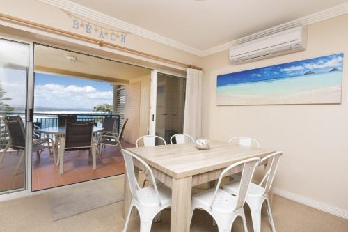 a dining room with a table and chairs at Whitesands 602 - linen not included in Forster