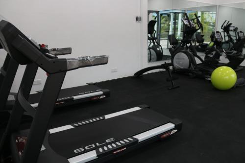a gym with two treadmills and a treadmill at EDC UUM Sintok in Sintuk