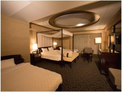 Кровать или кровати в номере Atami Season Hotel