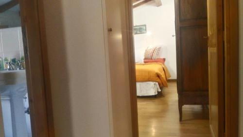 a bedroom with a bed with a yellow blanket at Baduerughe - ValledelLago in Poggio Mirteto