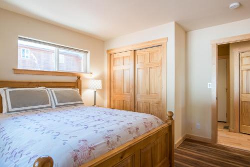 a bedroom with a bed and a window at North Shore - Golden Pine in Kings Beach