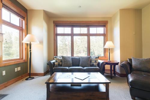 a living room with a couch and a coffee table at Cabins 21 in Old Mammoth