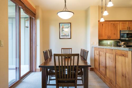 a kitchen with a dining room table and chairs at Cabins 21 in Old Mammoth