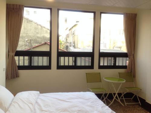 Postel nebo postele na pokoji v ubytování Kaishan B&B
