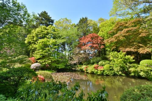 a garden with a pond in the middle at Hachinohe Park Hotel in Hachinohe