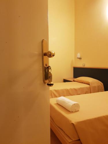 Hotel Le Cardinalにあるベッド