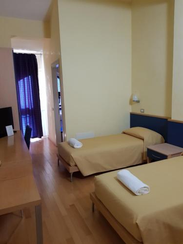 Hotel Le Cardinalにあるベッド