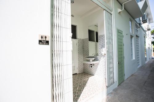a bathroom with a sink on the side of a building at Memmoth Hostel In Lampang in Lampang