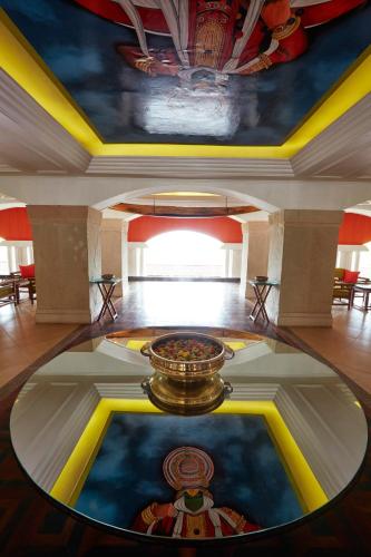 a room with a table in the middle of a building at Gateway Varkala in Varkala