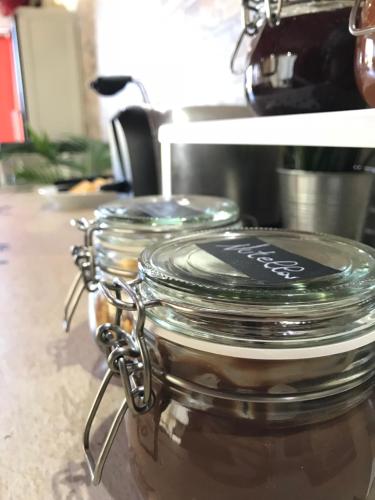 a jar with a label on it sitting on a counter at B&B Villa degli Angeli in Bernalda