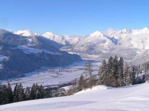 a view of a snow covered mountain with a valley at Zillertaler Sennhuette in Hart im Zillertal
