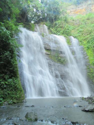 a waterfall in the middle of a river at Finca Hotel Guayacundo in Vergara
