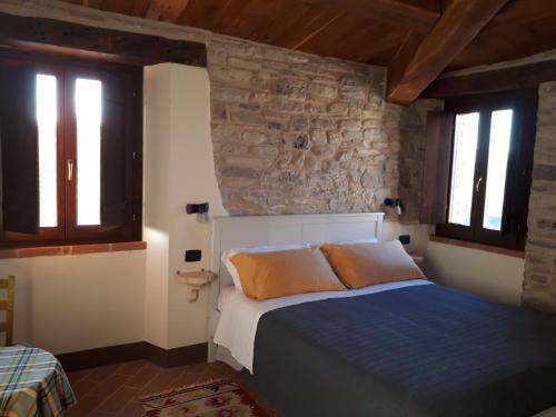 Un pat sau paturi într-o cameră la Il Gelso Room&breakfast