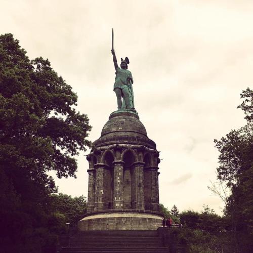 a statue of a woman on top of a tower at Stadthotel Detmold in Detmold