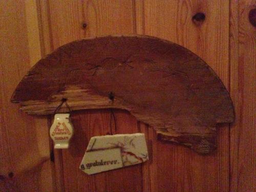 a wooden door with a shelf on a wall at Ivaregga Vinterstua in Tolga
