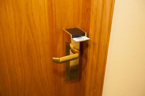a close up of a door with a box on it at Hotel PAYRO in Santiago de Compostela