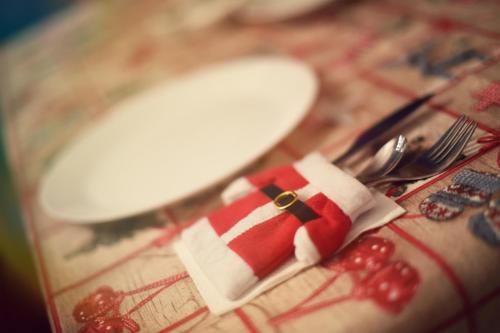a table with a knife and fork and a napkin at Bungalouri Horizont in Odorheiu Secuiesc