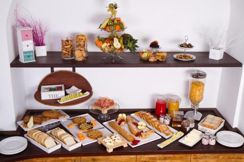a shelf with many different types of food on it at Cincinnato Wine Resort in Cori