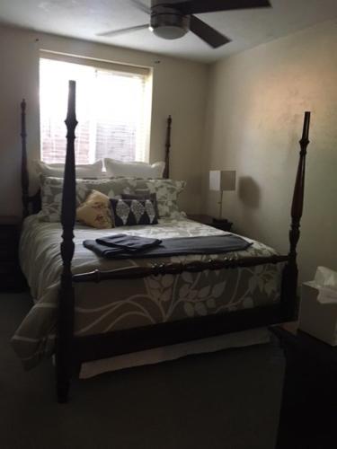 a bed in a room with a window and a bed sidx sidx sidx at Like Home but Better! A Boulder Favorite!! in Boulder