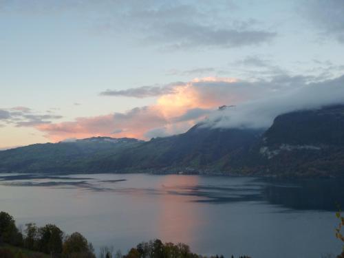 a view of a lake in the middle of a mountain at B&B Haussener in Krattigen