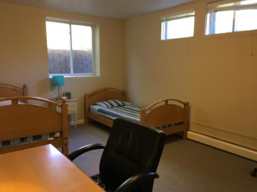a classroom with a bed and a table and chairs at Like Home but Better! A Boulder Favorite!! in Boulder