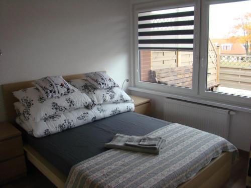 Posteľ alebo postele v izbe v ubytovaní Apartament Honey