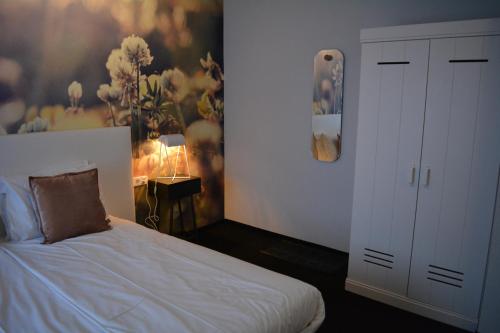 Łóżko lub łóżka w pokoju w obiekcie Hotel Herrloh