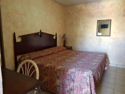 Postel nebo postele na pokoji v ubytování Hotel Colonial San Jorge