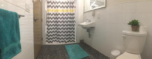 a bathroom with a toilet and a sink at Granville Hall Residence in Halifax