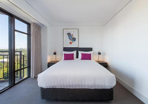 Postel nebo postele na pokoji v ubytování Avani Metropolis Auckland Residences
