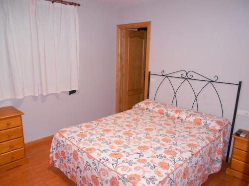 Ένα ή περισσότερα κρεβάτια σε δωμάτιο στο Hostal Donaire