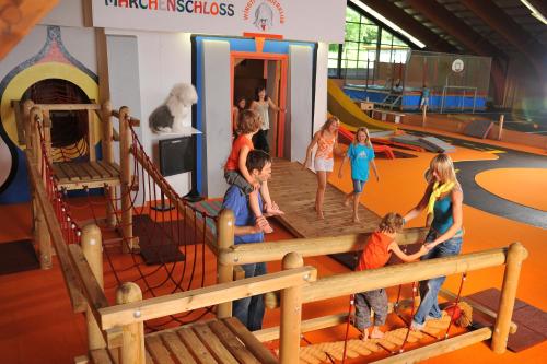 a group of children playing on a playground at Familienhotel Sonngastein in Bad Gastein