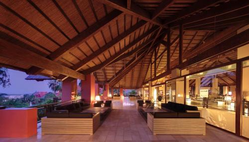 a lobby of a resort with couches and tables at Asia Gardens Hotel & Thai Spa, a Royal Hideaway Hotel in Finestrat
