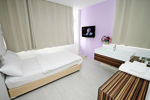 Säng eller sängar i ett rum på Nantra Ekamai Hotel