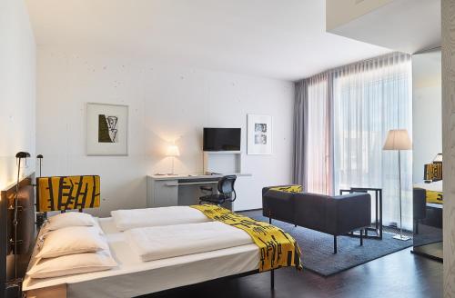 Postel nebo postele na pokoji v ubytování LOISIUM Wine & Spa Hotel Langenlois