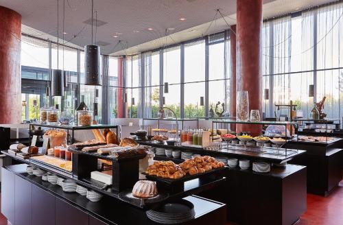 a buffet line with many different types of food at LOISIUM Wine & Spa Hotel Langenlois in Langenlois