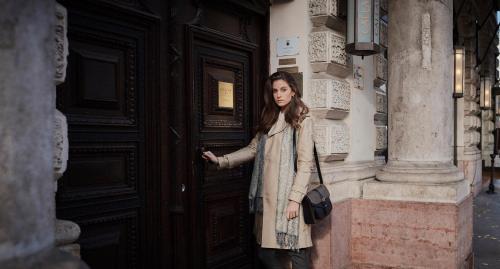 a woman standing in front of a door at Callas House in Budapest