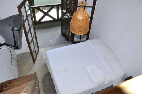 
A bed or beds in a room at Pousada Pedra Porosa
