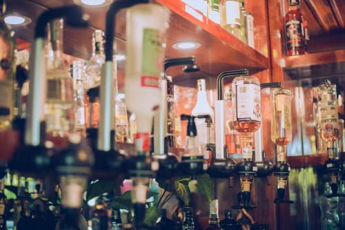 a bar filled with lots of bottles of alcohol at Phong Nha Lake House Resort in Phong Nha