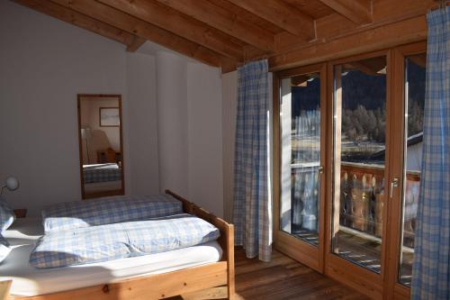 Postel nebo postele na pokoji v ubytování Residence Miragolf