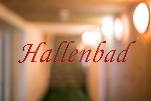 a red sign that reads hallender written on a window at Panorama Hotel Turracher Höhe in Turracher Hohe