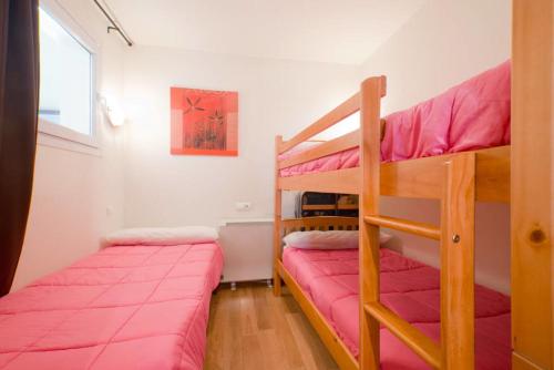 Un pat suprapus sau paturi suprapuse la Apartamento Deluxe a Pie de Pista Miramar Ski